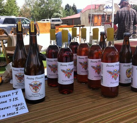 Bottles of Chasing Paradise hard cider and mead